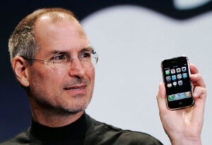 Steve jobs holding iphone